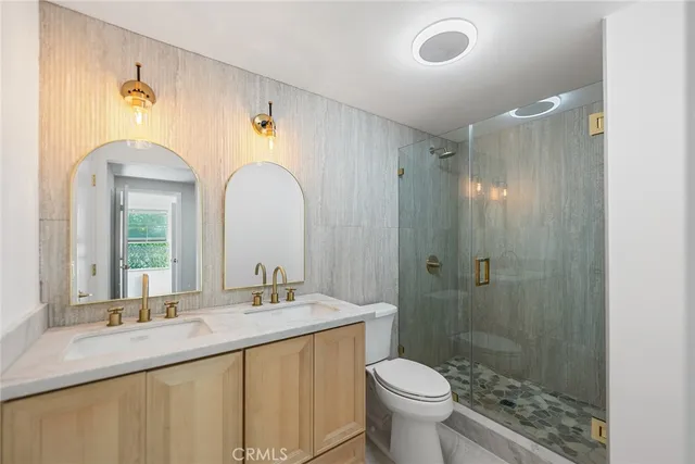 a view of a kitchen with white cabinets and sink