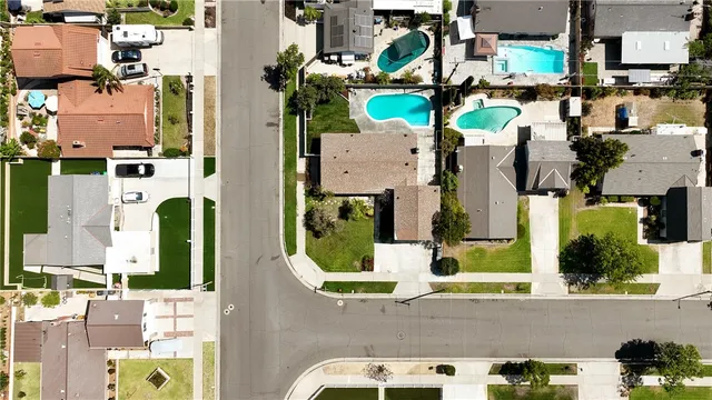 an aerial view of houses with outdoor space