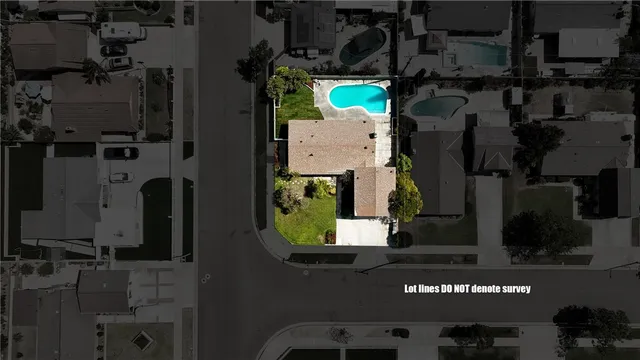 an aerial view of houses with an outdoor space