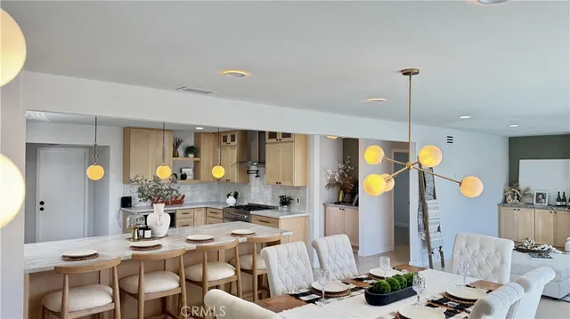 a dining room filled with furniture and wooden floor