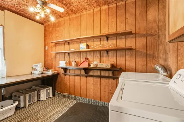 a view of a kitchen with a sink and cabinets