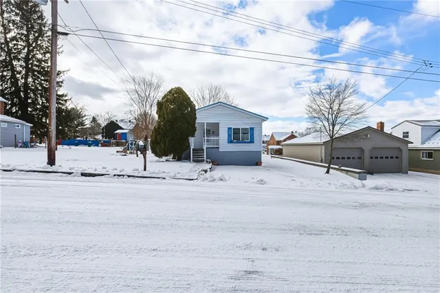 a view of a house with a snow