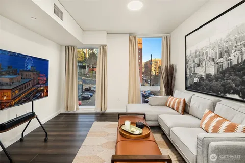 a living room with furniture and a large window