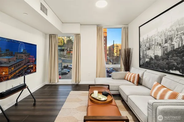 a living room with furniture and a large window