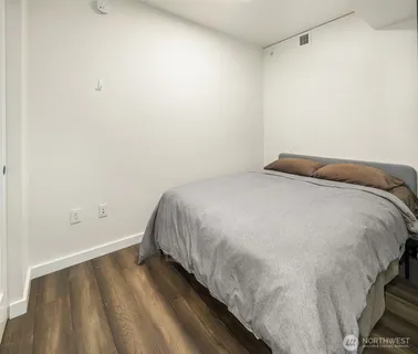 a bedroom with a bed and cabinets