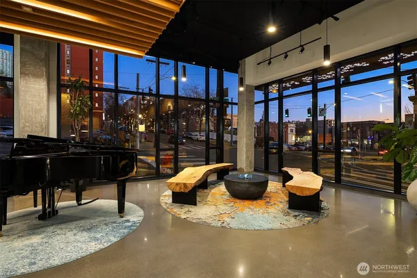 a view of living room kitchen and entryway