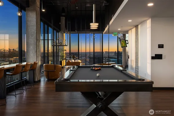 a living room with fireplace furniture and a floor to ceiling window