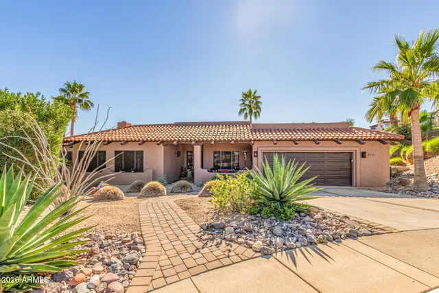 a view of a balcony with chairs