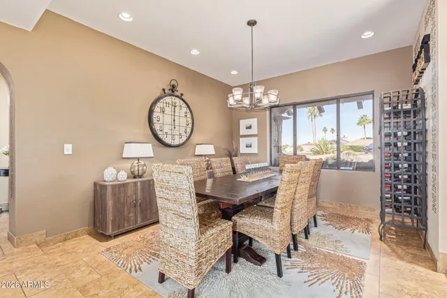 a bathroom with a granite countertop double vanity sink and a mirror