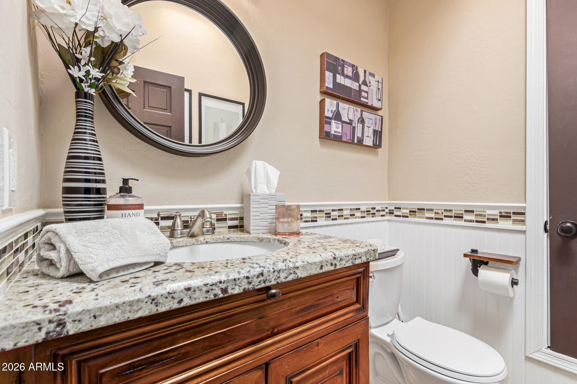1932 East Beck Lane Phoenix, AZ 85022 - Photo 20 of 52 a bathroom with a granite countertop toilet and a sink