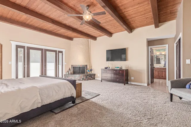 a living room with furniture and large windows