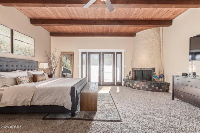 a view of a swimming pool with a patio and a yard