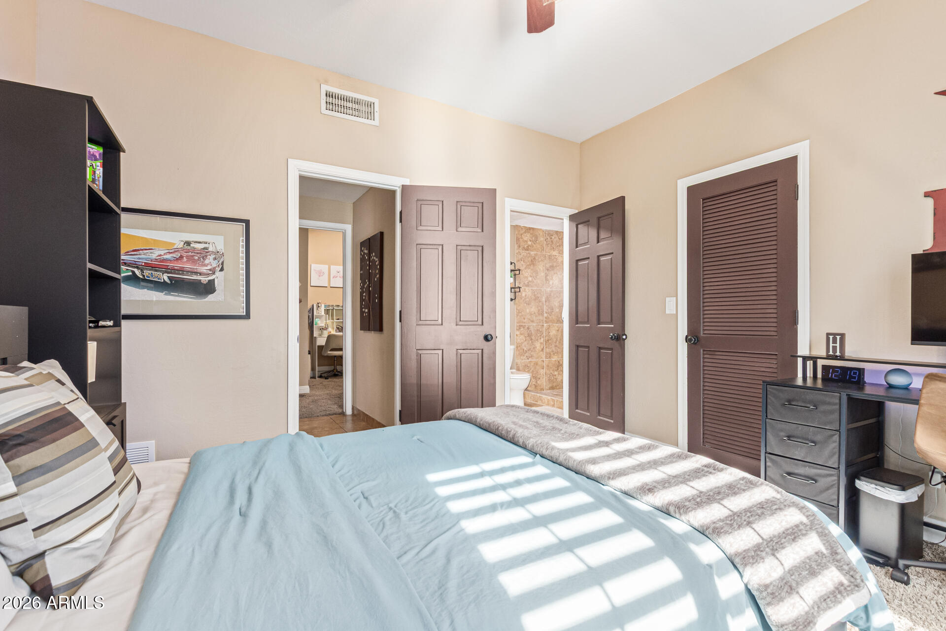 1932 East Beck Lane Phoenix, AZ 85022 - Photo 32 of 52 a bedroom with a bed and a desk