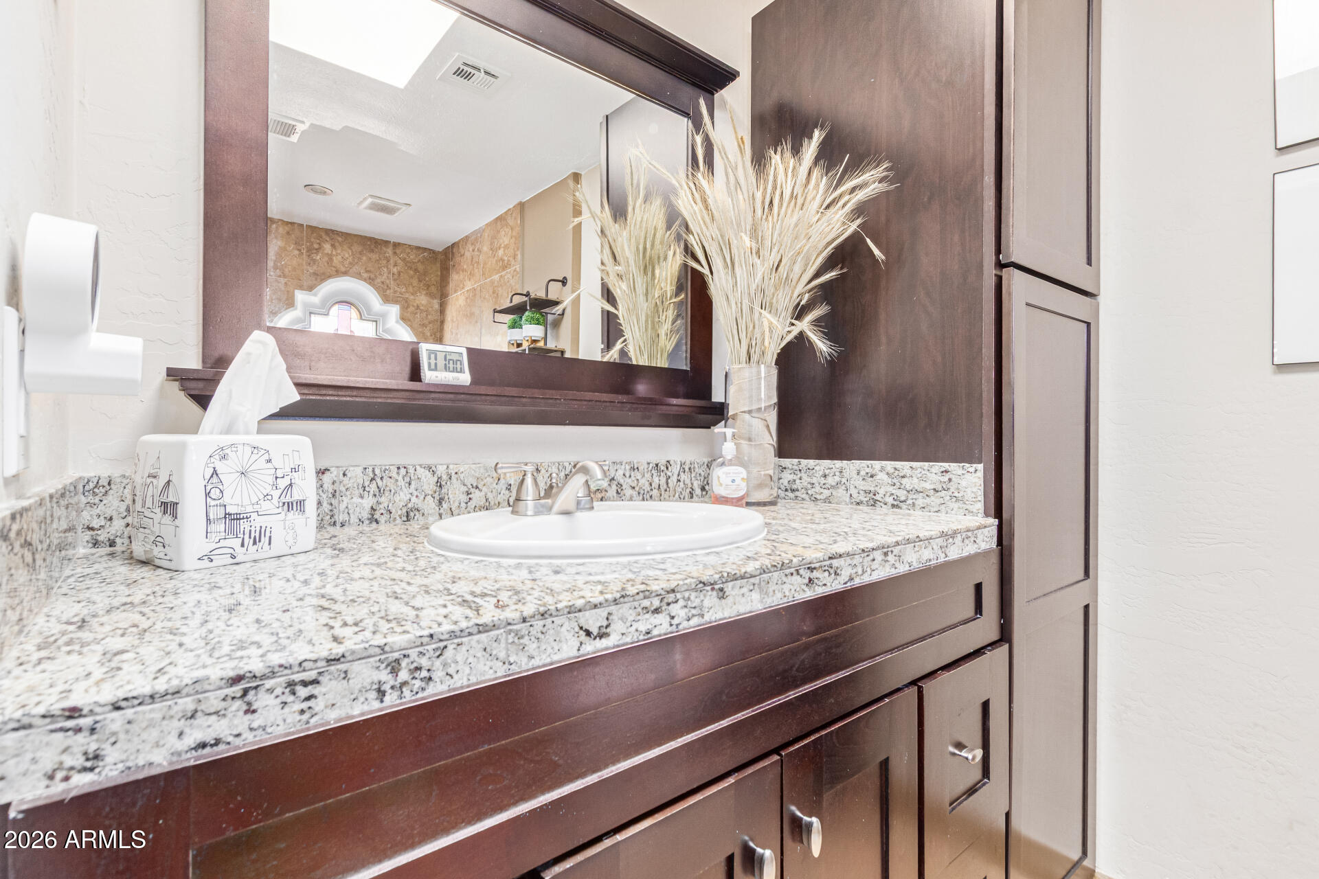 1932 East Beck Lane Phoenix, AZ 85022 - Photo 33 of 52 a bathroom with a granite countertop sink and a mirror