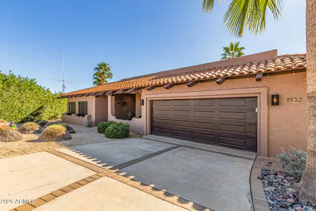 a kitchen with stainless steel appliances granite countertop a refrigerator and a stove
