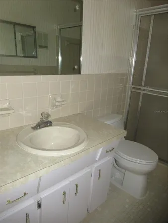 a bathroom with a sink and toilet