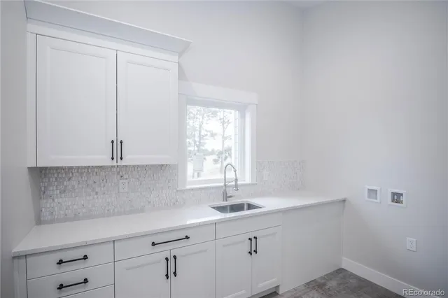 a bathroom with a sink and a window