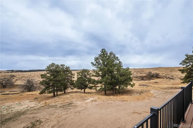 a view of balcony with wooden floor and city view