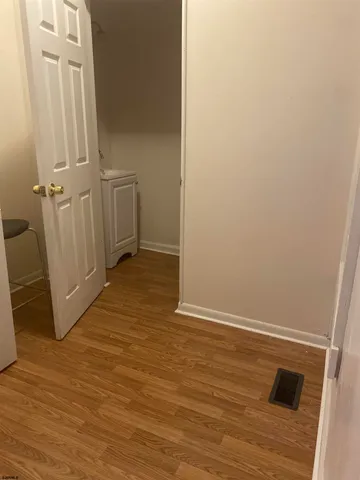 an empty room with wooden floor