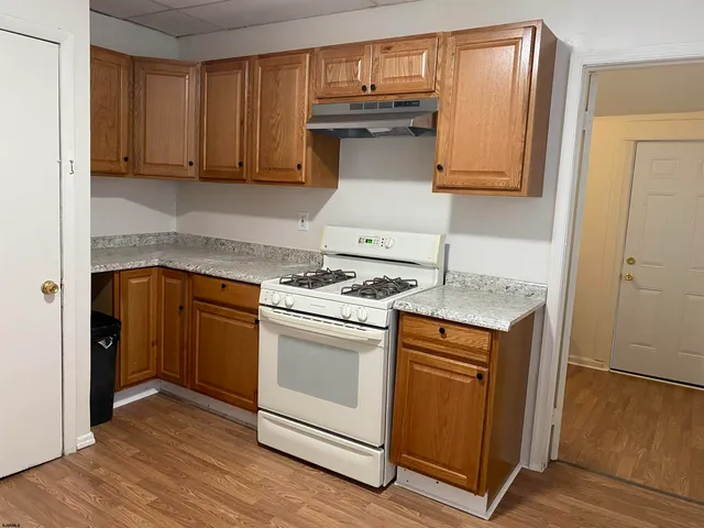 a kitchen with a stove and a microwave