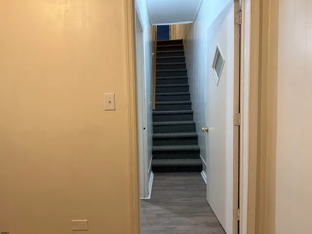 a view of a hallway with stairs