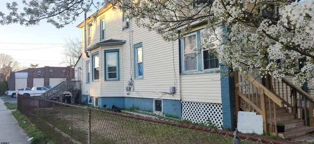a view of a house with a tree