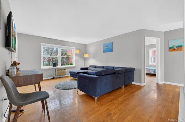 a living room with furniture and a window