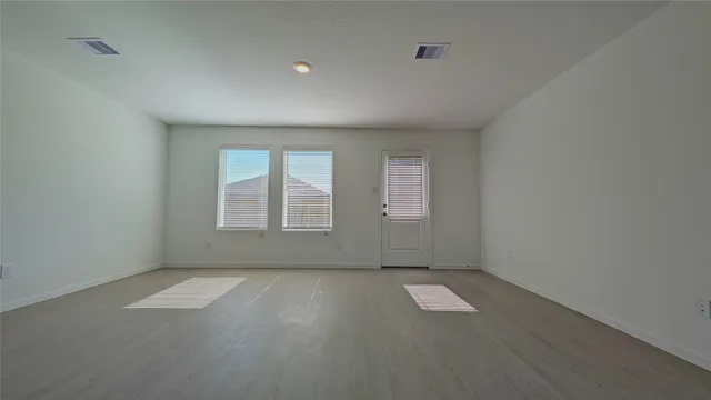 a view of a kitchen with a sink and a window