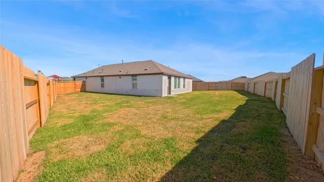 a view of swimming pool with outdoor seating and a potted plant