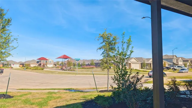 a view of swimming pool with a lawn chairs
