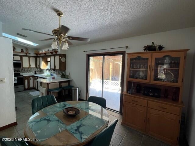 8 North Trident Place St. Augustine, FL 32080 - Photo 12 of 26 a kitchen with stainless steel appliances granite countertop a stove and a refrigerator