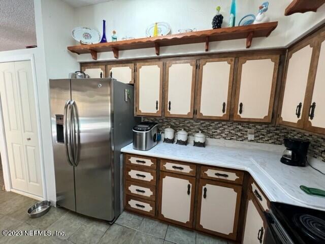 8 North Trident Place St. Augustine, FL 32080 - Photo 15 of 26 a kitchen with stainless steel appliances a sink a stove and cabinets