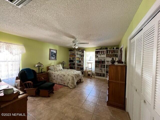 8 North Trident Place St. Augustine, FL 32080 - Photo 16 of 26 a living room with furniture gym equipment and a window