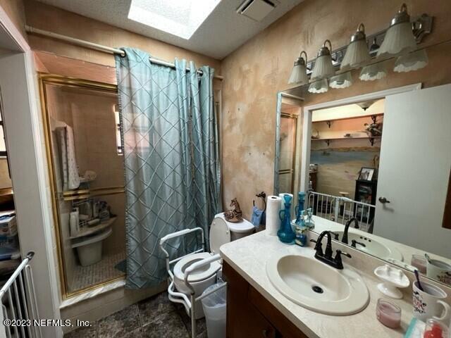 8 North Trident Place St. Augustine, FL 32080 - Photo 18 of 26 a bathroom with a sink toilet and shower
