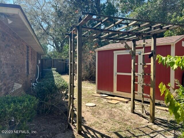 8 North Trident Place St. Augustine, FL 32080 - Photo 26 of 26 a view of a house with a small yard and potted plants