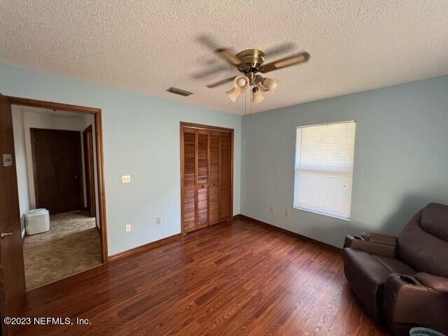 8 North Trident Place St. Augustine, FL 32080 - Photo 7 of 26 a view of an empty room with wooden floor and a window