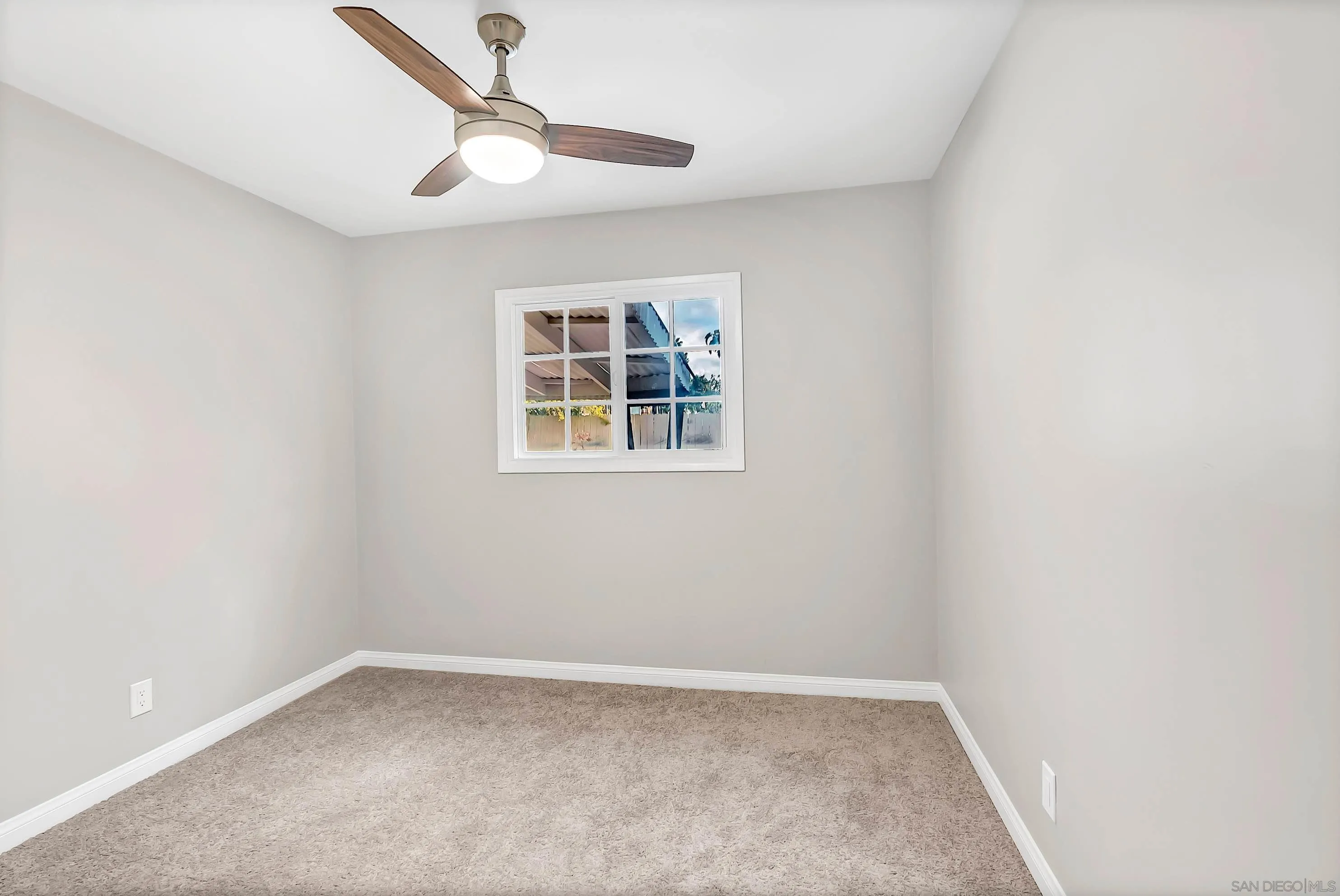 9215 Lake Canyon Road Santee, CA 92071 - Photo 11 of 18 an empty room with a window and a fan