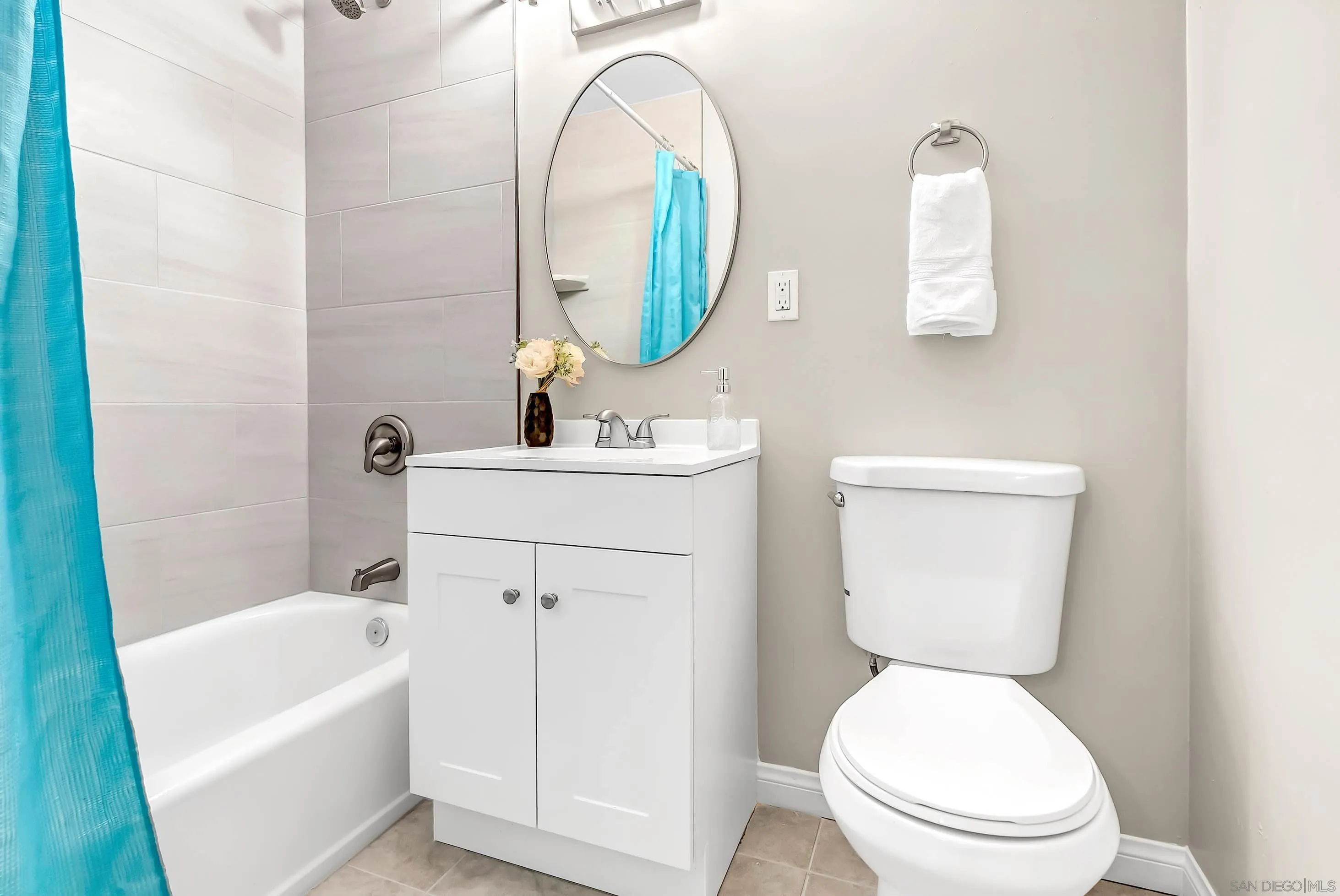 9215 Lake Canyon Road Santee, CA 92071 - Photo 12 of 18 a white toilet sitting next to a bathroom sink