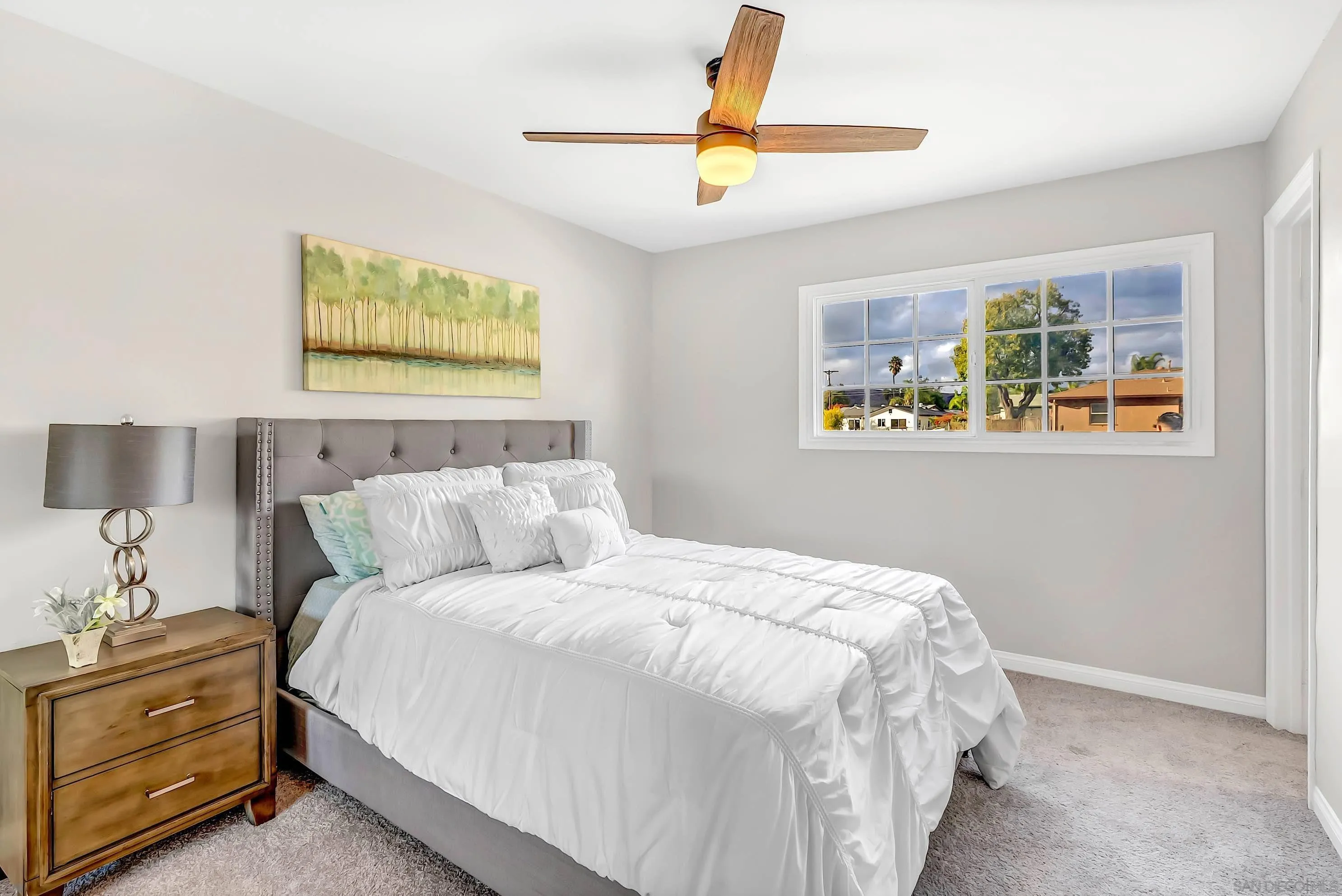 9215 Lake Canyon Road Santee, CA 92071 - Photo 9 of 18 a bedroom with a bed and a painting on the wall