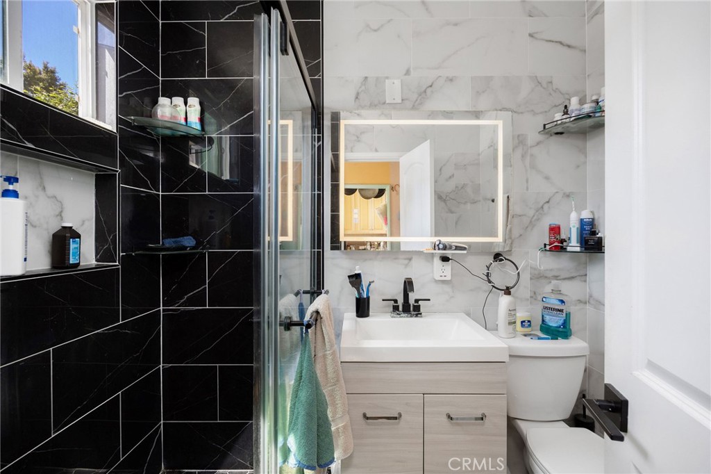 2905 Rindge Lane Redondo Beach, CA 90278 - Photo 19 of 26 a bathroom with a sink toilet and shower