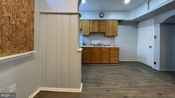 a view of a kitchen with wooden floor