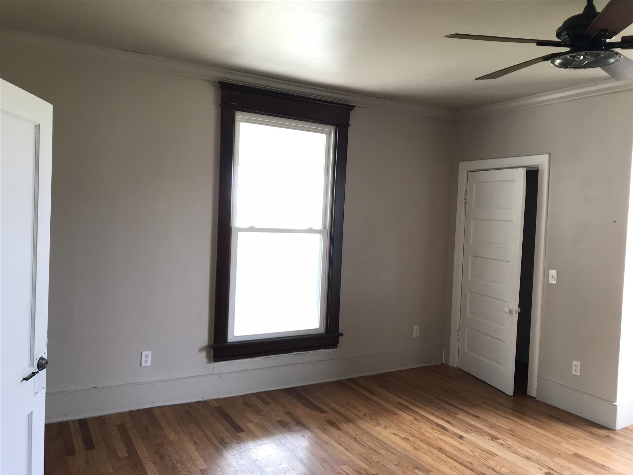 4337 Airport Road Springfield, TN 37172 - Photo 4 of 22 a view of an empty room with wooden floor and a window