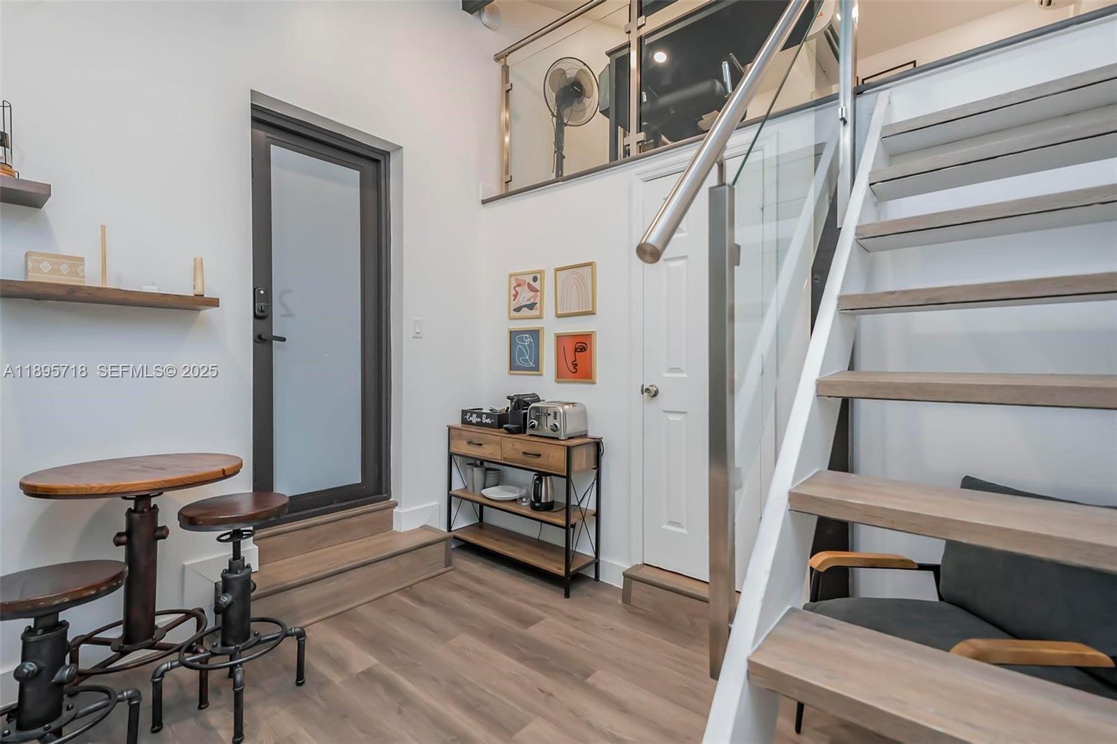 870 Northeast 82nd Street, Unit 2 Miami, FL 33138 - Photo 3 of 8 a view of a hallway with furniture and a window