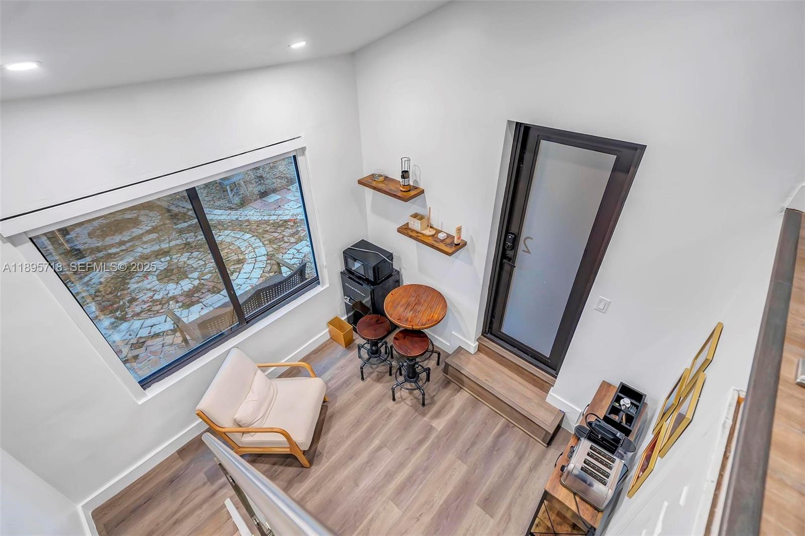 870 Northeast 82nd Street, Unit 2 Miami, FL 33138 - Photo 5 of 8 a living room with furniture and a rug