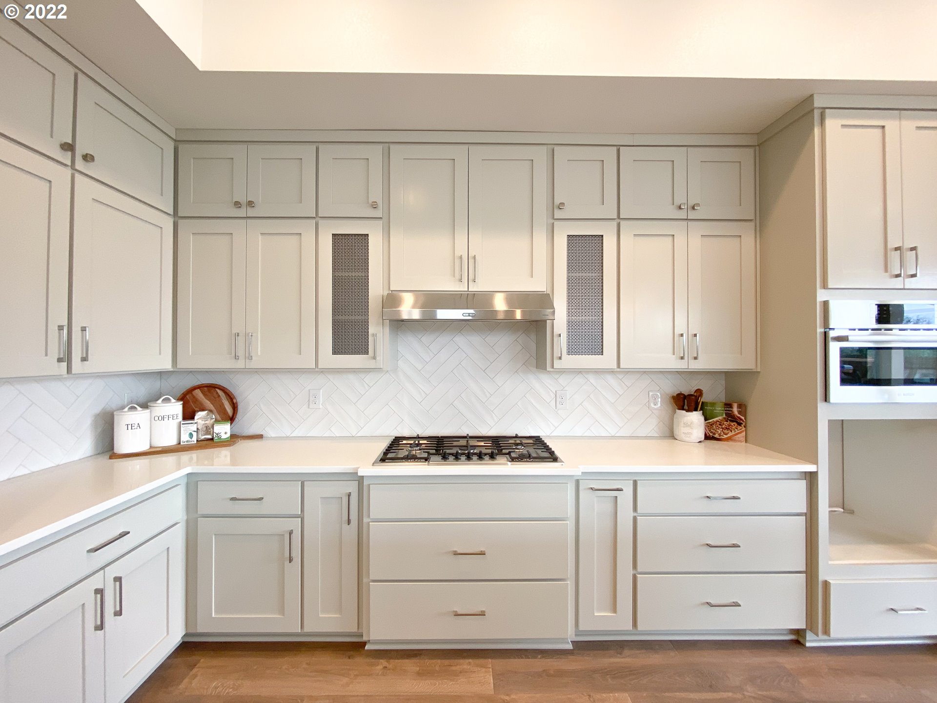 817 South Goose Loop Ridgefield, WA 98642 - Photo 4 of 31 a kitchen with white cabinets and white appliances