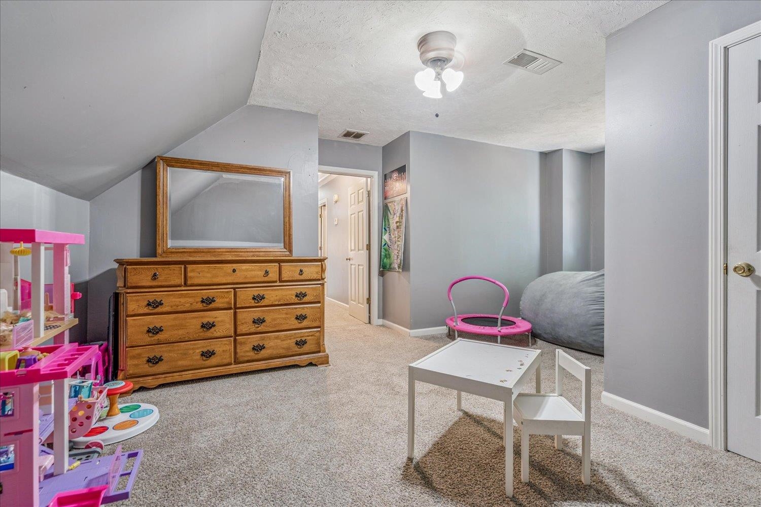 220 Sawmill Road Brighton, TN 38011 - Photo 23 of 25 Playroom featuring light colored carpet, vaulted ceiling, and a textured ceiling