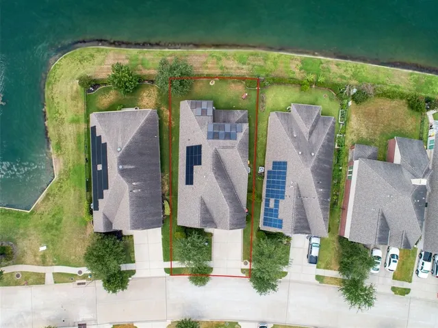 an aerial view of houses with outdoor space