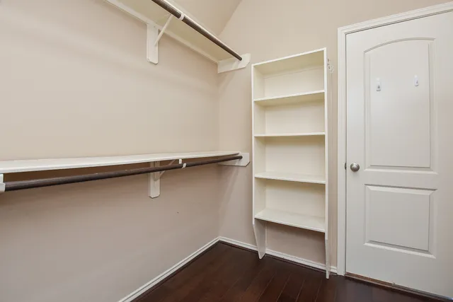 a view of an empty walk in closet