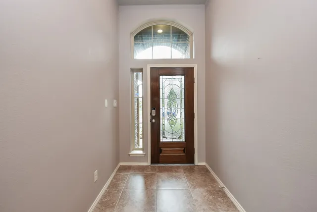 an empty room that has a window in it