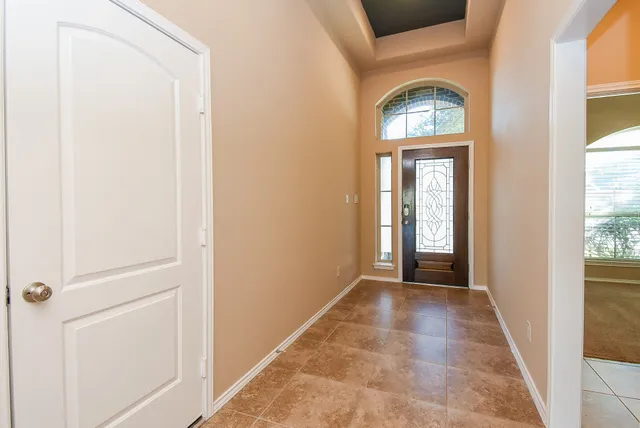 a view of a hallway with front door